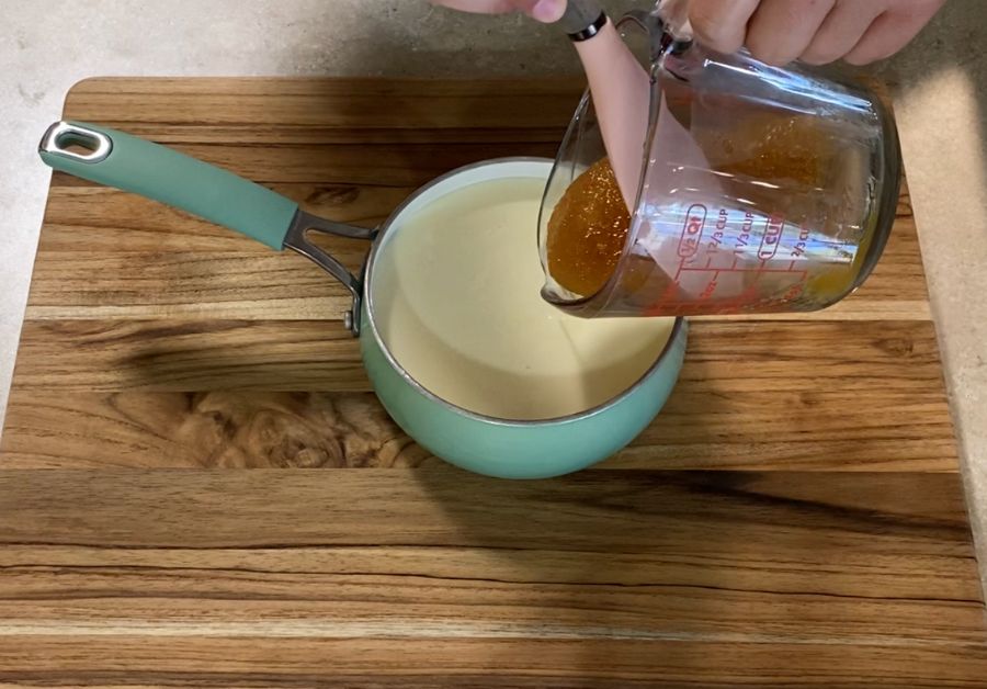 putting honey into the pan with milk and butter
