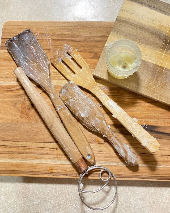 jar of spoon butter and covered wooden utensils