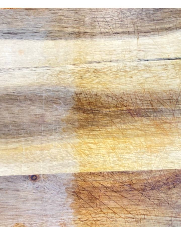 half reconditioned and half dry wooden cutting board