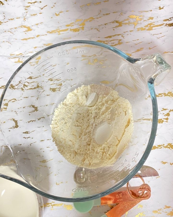 flour salt and baking powder inside a mixing bowl