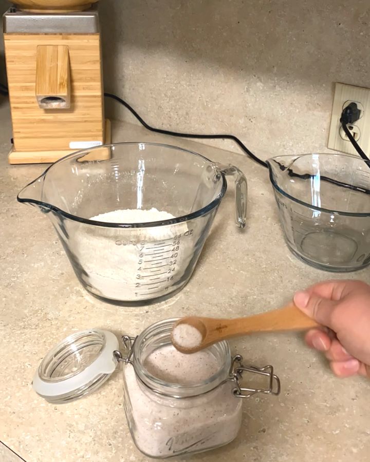 Measuring half a teaspoon of salt.