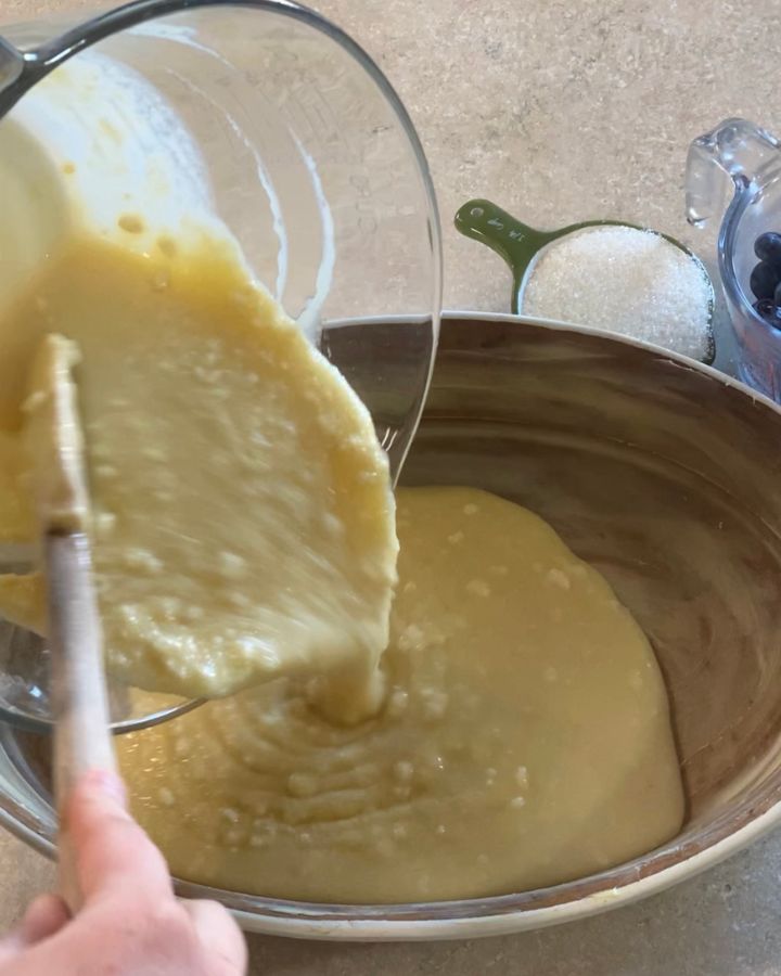pouring batter into a buttered dish