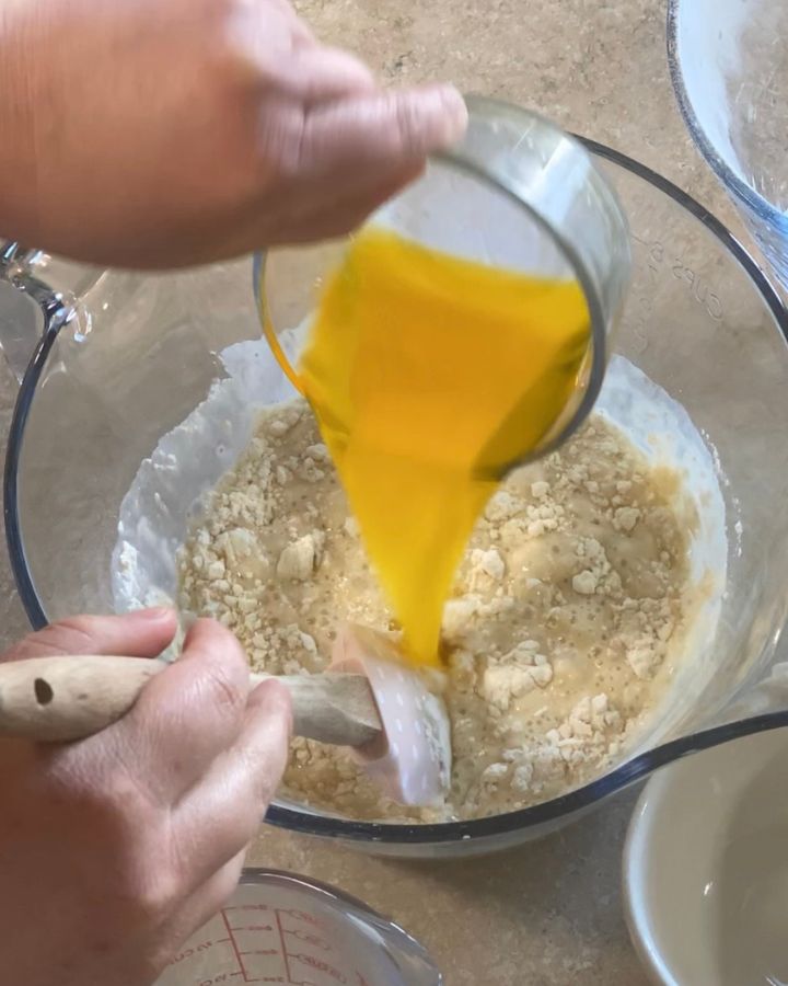 pouring melted butter into mixture
