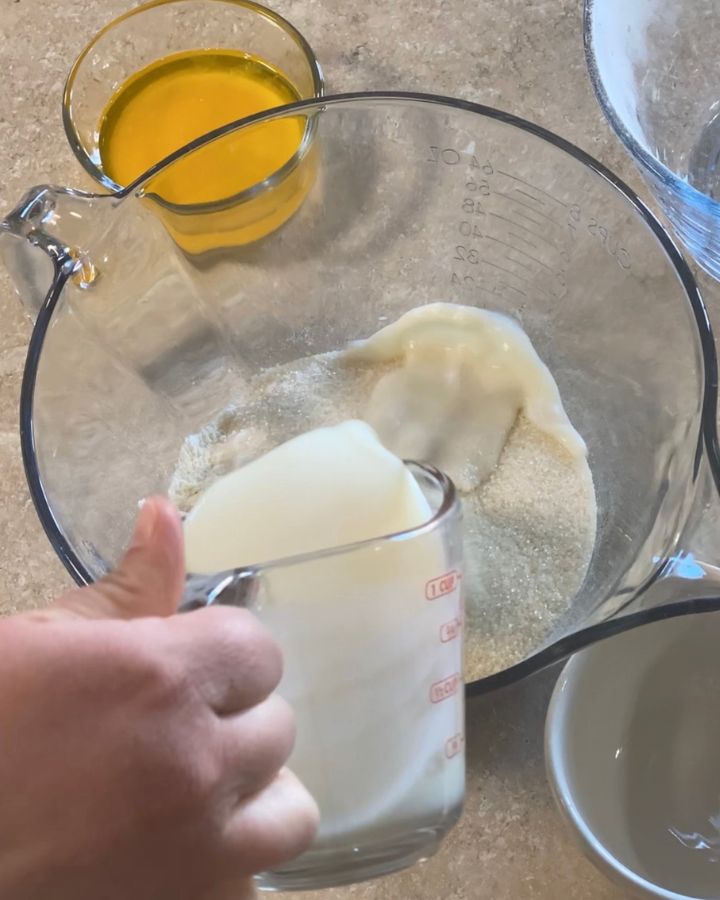 adding milk to the dry ingredients